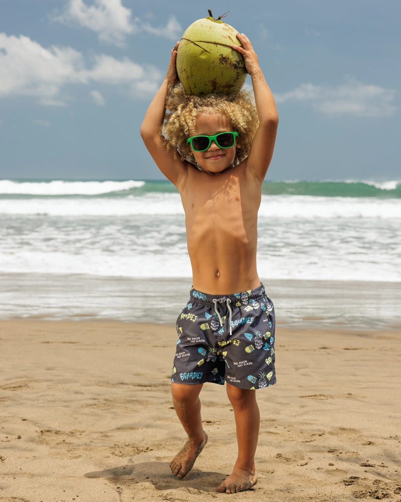 Keanu Tetteh balancing a coconut on his head on a Bali beach