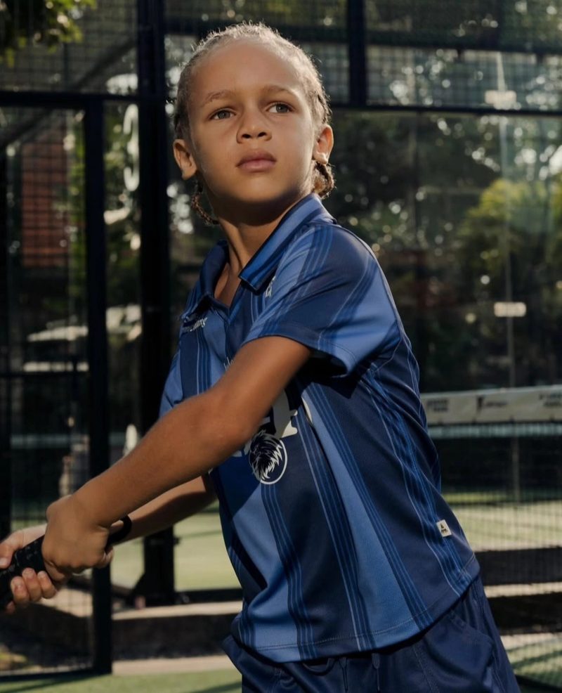 Keanu Tetteh playing padel in a blue sports kit